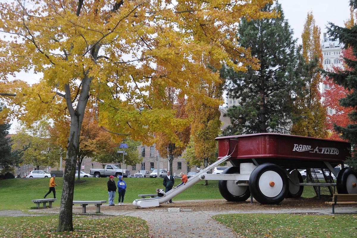 Fall colors surround the Red Wagon in Riverfront Park in 2010. (Dan Pelle / The Spokesman-Review)