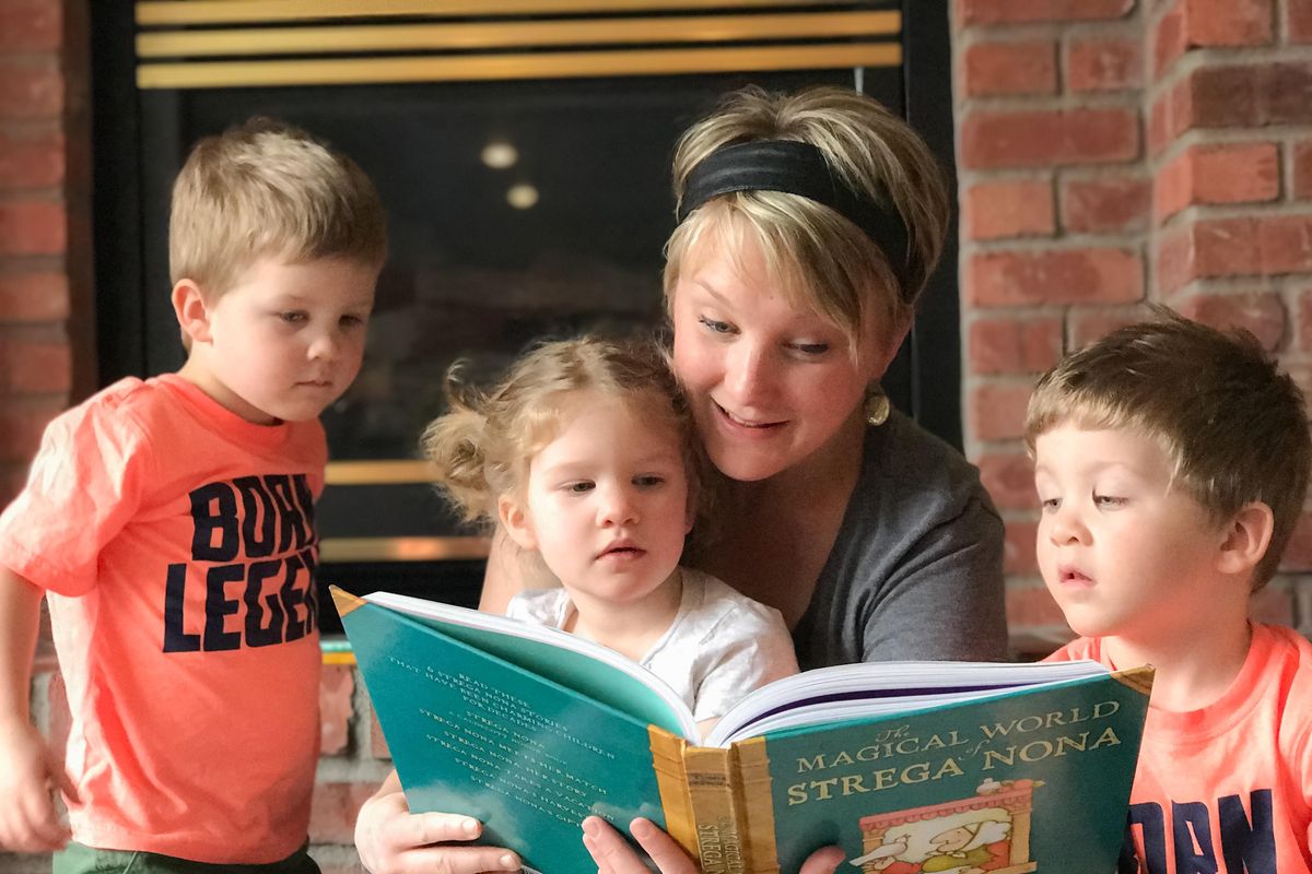 Sarah Mackenzie, Spokane author of “The Read-Aloud Family,” writes about how families bond and children benefit from hearing literature 
spoken out loud, even through teenage years. Here Mackenzie is reading to three of her younger kids, from left, Becket, Clara and Emerson Menck. (Courtesy of Sarah Mackenzie)