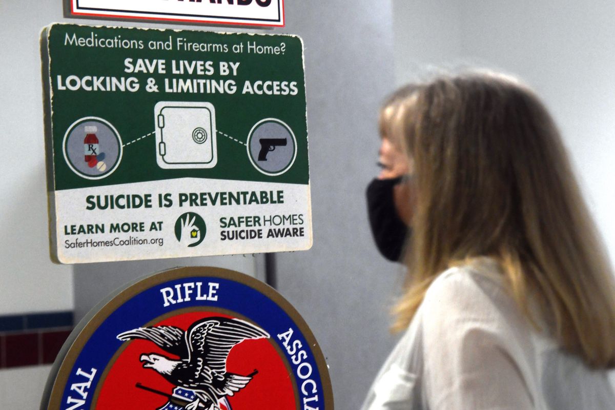 Informational material from Safer Homes Suicide Aware is on display at Sharp Shooting Indoor Range & Gun Shop in Spokane on Wednesday, July 15, 2020. Robin Ball, Sharp Shooting owner is on the board.  (Kathy Plonka/The Spokesman-Review)