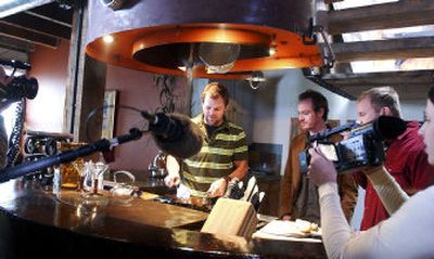 
A Home and Garden Television crew films at the West Main Street loft of Dan Spalding.  Spalding renovated the building with the help of his friends, Tim Biggs and Sean Smith, to Spalding's left. HGTV filmed several homes while in Spokane. 
 (Kathryn Stevens / The Spokesman-Review)