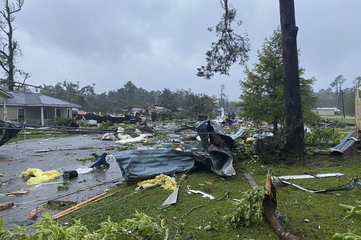 This photo provided by Alicia Jossey shows debris covering the street in East Brewton, Ala., on Saturday, June 19, 2021. Authorities in Alabama say a suspected tornado spurred by Tropical Storm Claudette demolished or badly damaged at least 50 homes in the small town just north of the Florida border.  (HONS)