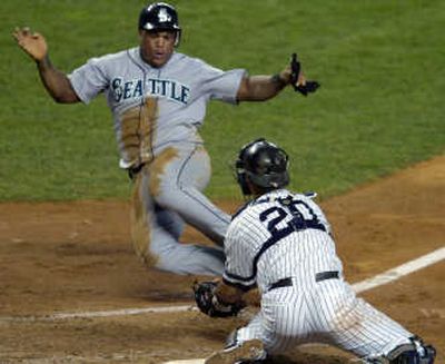
Jorge Posada tags out Mariners' Adrian Beltre at home plate in the fifth inning. Associated Press
 (Associated Press / The Spokesman-Review)