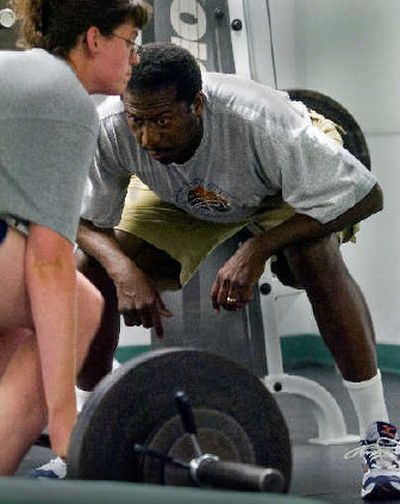
Pat Gray helps weightlifter Karie Luce work on her posture and technique at the YMCA as they prepare for a national meet.
 (CHRISTOPHER ANDERSON / The Spokesman-Review)