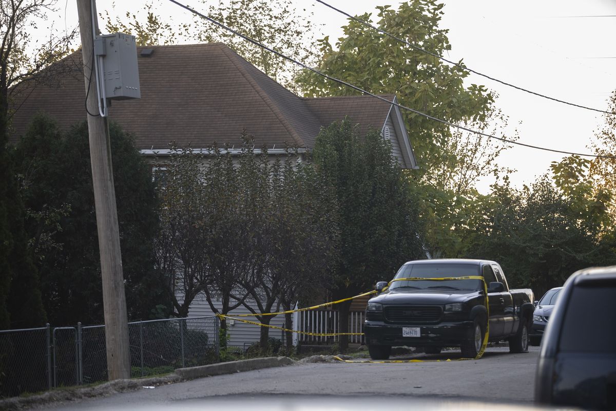 Police tape blocks off access to a fatal shooting at a house early Sunday, Oct. 31, 2021 in Joliet, Ill. Police were seeking tips from the public in finding two suspected shooters who fled from the scene and were also seeking witnesses or anyone who may have video or photographs from the party. (Anthony Vazquez)