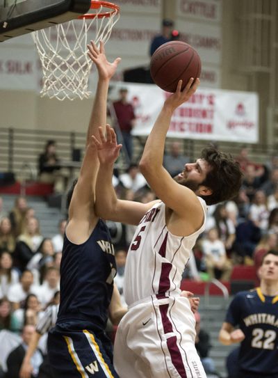 Whitworth forward Christian Jurlina drives to the basket as Whitman's Philip Chircu in the first half last Tuesday at Whitworth. The win over the Missionaries, coupled with the win over Pacific on Friday, moved the Pirates into the top spot in the D3hoops.com Top 25 poll. (Colin Mulvany / The Spokesman-Review)