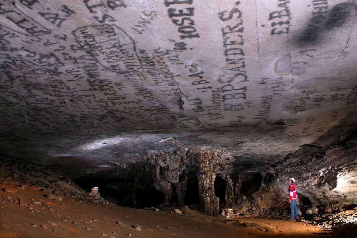 A caver checks out the rock formations in Mammoth Cave National Park’s Gothic Avenue, so named because the formations resemble Gothic architecture.  (Courtesy of Mammoth Cave National Park)