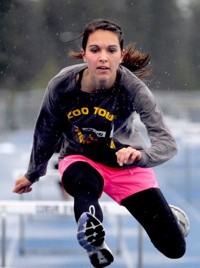 Morgan Struble of Coeur d'Alene HS, flies over  the hurdles duing practice. She transferred  from Missoula last fall and leads state of Idaho in 300-meter hurdles and is second in the 100-meter hurdles. (Kathy Plonka)