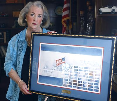 Caryl Jordan Baum, of Roseburg, Ore., displays a painting created in 1991 by her mother. Jordan Baum  believes it prophetically depicted the Sept. 11 terrorist attack.  (Associated Press)