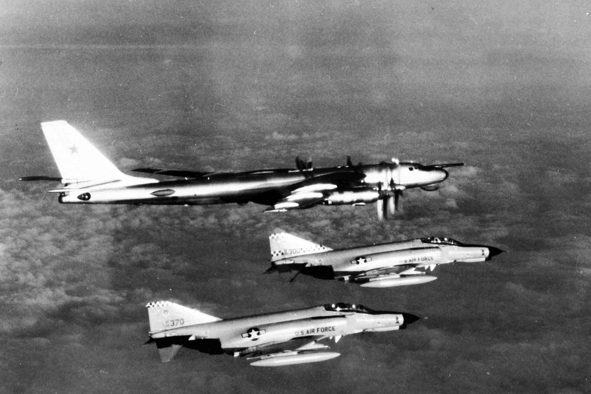In this photo provided by the U.S. Air Force, two Air Force Phantom II interceptors fly alongside a Soviet Tu-95 "Bear," a bomber converted for reconnaissance, over the North Atlantic in Nov. 1980. The Russian Defense Ministry said Wednesday that four Tu-95 bombers have flown over the Sea of Okhotsk, the Bering Sea, the Chukchi Sea and the Northern Pacific during an 11-hour mission. The ministry said the bombers were shadowed by U.S. F-22 fighters during part of their patrol.  (R. Diaz)