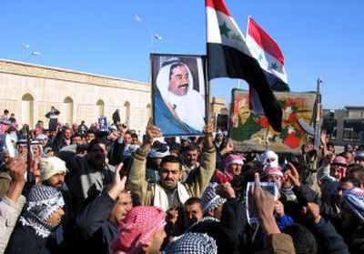 
Iraqis protest the execution of former President Saddam Hussein in the Sunni stronghold of Tikrit on Tuesday. Sunni Muslims have taken to the streets in recent days in mainly peaceful demonstrations. 
 (Associated Press / The Spokesman-Review)