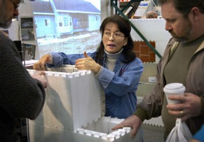 
Insulated Building Materials owner Lorna Hamilton answers questions Saturday about SmartBlocks at the Spokane Home & Yard Show, which concludes today at the Spokane Fairgrounds. 
 (Holly Pickett / The Spokesman-Review)