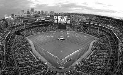 
The Atlanta Braves, right, and the New York Mets stand on the baselines at Turner Field in Atlanta during opening day ceremonies. 
 (File Associated Press / The Spokesman-Review)