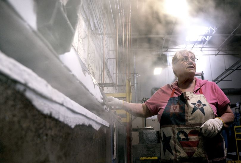 Nanci Brum, 62, of Post Falls in the heat treat department at Buck Knives in Post Falls on Wednesday, May 20, 2009. Buck Knives recently launched an initiative called the 