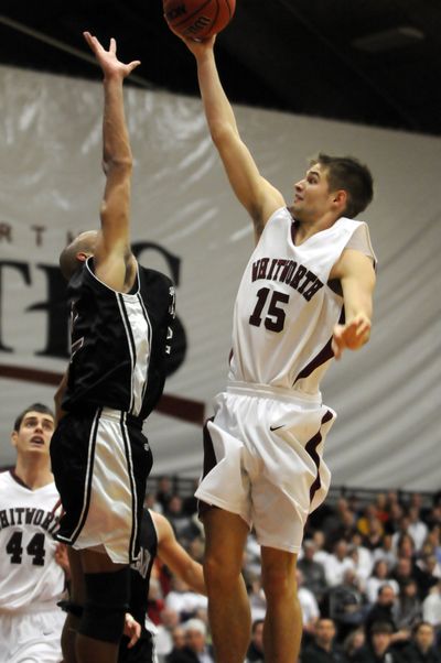 Whitworth's David Riley, right, puts up shot against Chapman in last season's NCAA Division III playoff games.  (Jesse Tinsley / The Spokesman-Review)