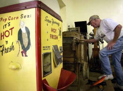 
Don Gorman dusts off an 1890 washing machine in the Valley Heritage Center Monday. Volunteers are preparing for an open house on Friday. 
 (Liz Kishimoto / The Spokesman-Review)