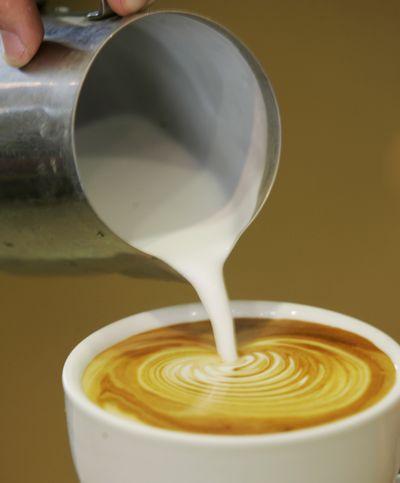 A study shows holding a hot cup of coffee makes people warm up emotionally, too. (Associated Press / The Spokesman-Review)