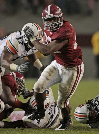 Alabama’s Mark Ingram scores on a 14-yard run against Auburn.  (Associated Press / The Spokesman-Review)