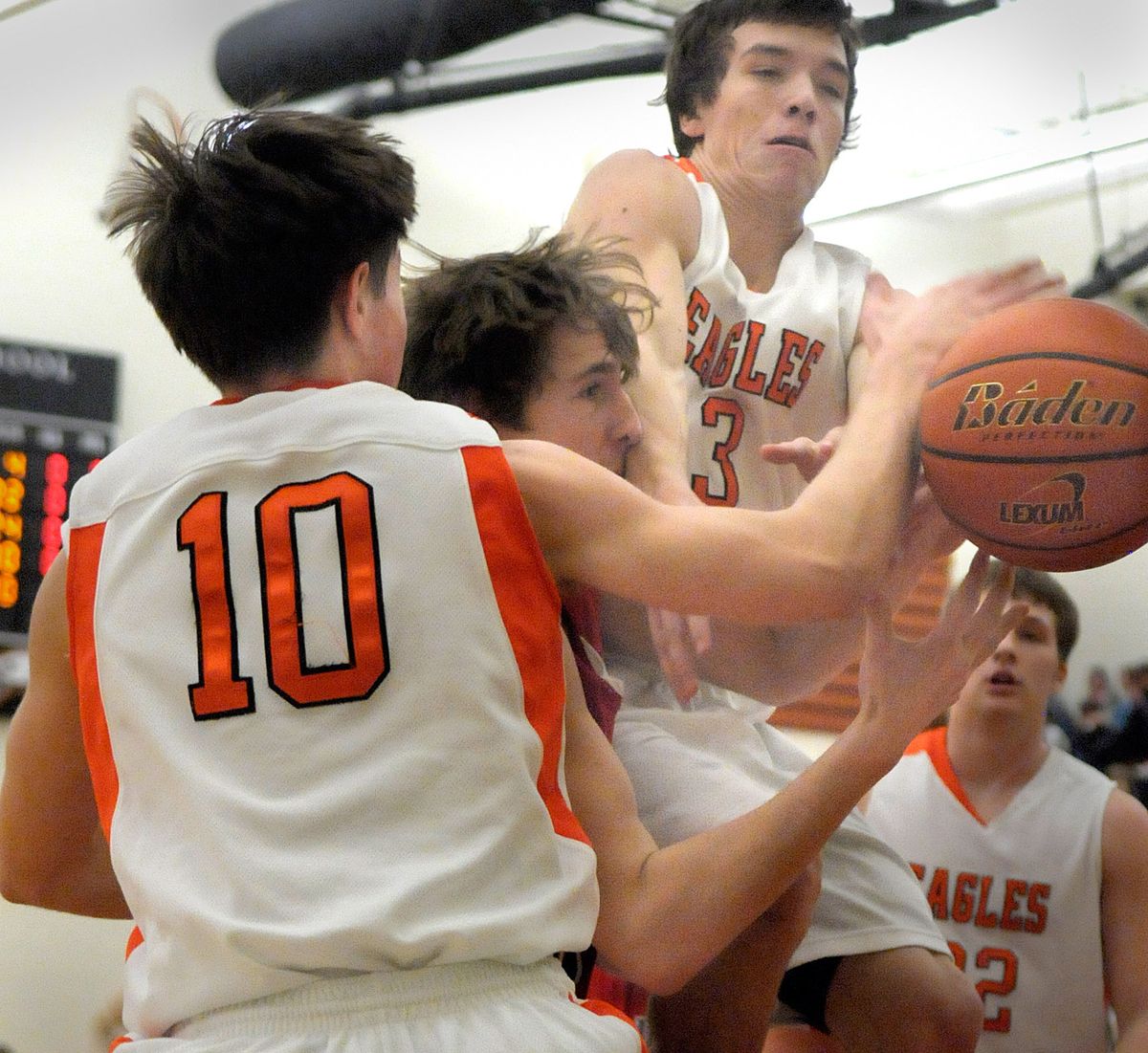 Matt Roth (10) and Alex Allison (3) of West Valley sandwich a Clarkston player while chasing a rebound Friday night at WV. (Christopher Anderson / The Spokesman-Review)