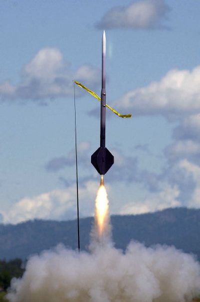 
David Glass' built-from-scratch rocket, the Purple Hazmat, takes off during the Spokane Area Rocket Club's weekend launch Sunday on Carey Road.
 (Liz Kishimoto / The Spokesman-Review)