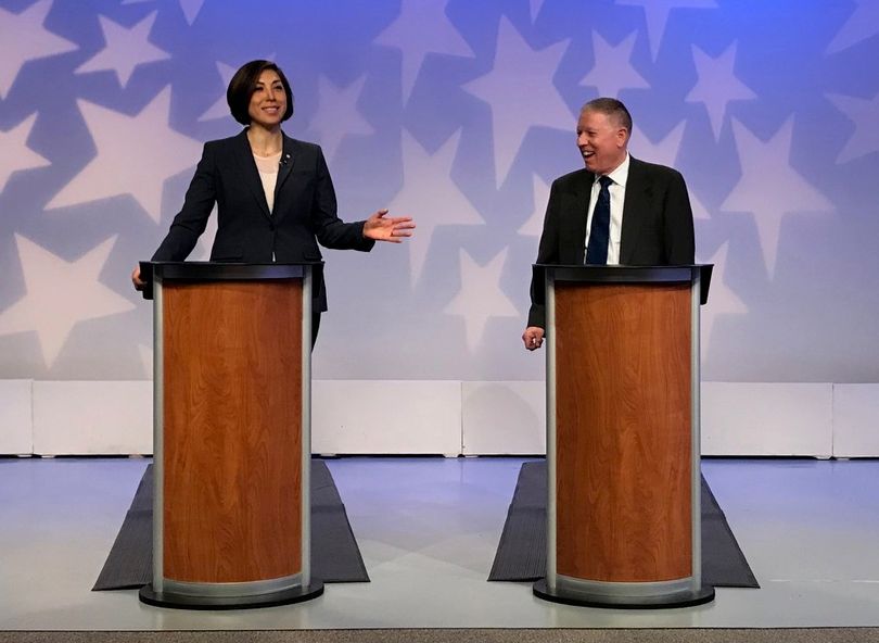 Paulette Jordan, left, and A.J. Balukoff, right, debate during the 