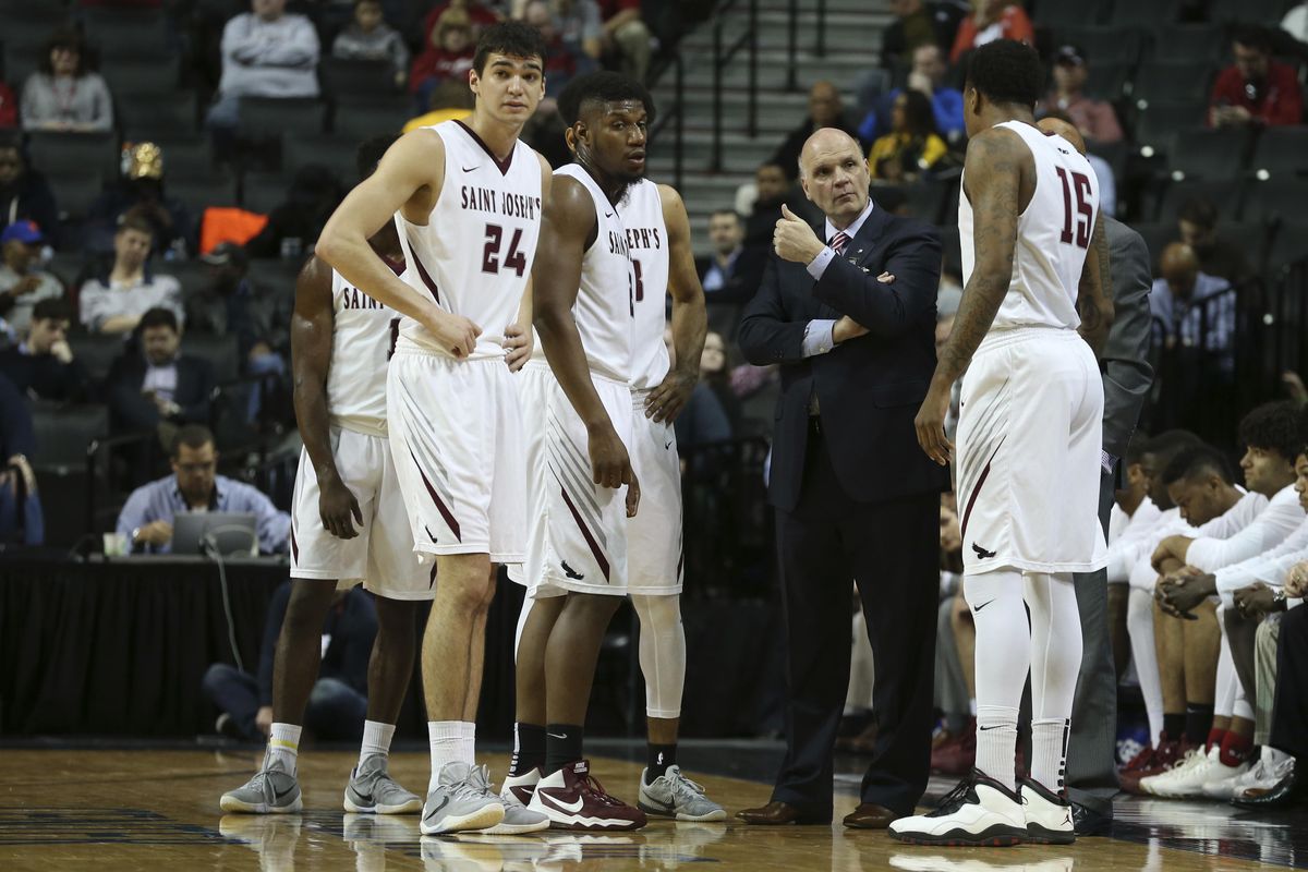 Saint Joseph head coach Phil Martelli talks to his players during a time out in the first half of an NCAA college basketball game against George Washington in the Atlantic 10 men’s tournament, Friday, March 11, 2016, in New York. (Mary Altaffer / Associated Press)