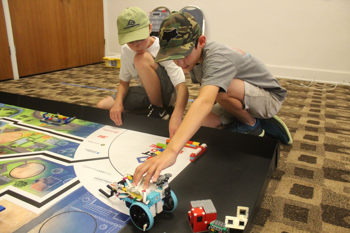 Greyson Baker and Gentry Hawk of the Engineers group prepare their robot for an upcoming challenge at the Lego Challenge Camp held at the Westminster Congregational Church on Thursday July 28, 2022.  (Jordan Tolley-Turner/For the Spokesman-Review)