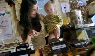 “Everything is her favorite kind,” said Megan Krizenesky about her daughter Zaylee, 1, at the family owned Spirit Lake Video/ fudge/ice cream shop on Tuesday.  (Kathy Plonka / The Spokesman-Review)