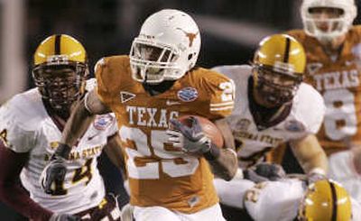 
Texas' Jamaal Charles breaks past ASU's defense for a long gain. Associated Press
 (Associated Press / The Spokesman-Review)