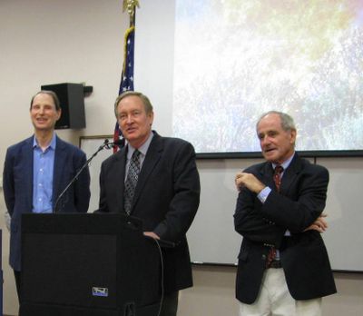 Sen. Mike Crapo, center, speaks at the Boise Interagency Fire Center on Monday; at left is Oregon Sen. Ron Wyden, at right, Idaho Sen. Jim Risch (Betsy Z. Russell)