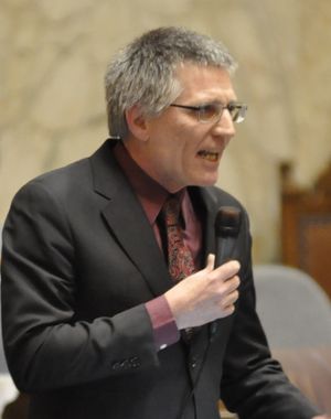 OLYMPIA -- Rep. Timm Ormsby, D-Spokane, urges House members to vote yes on a bill to raise the minimum wage to $12 an hour by 2020. (Jim Camden)