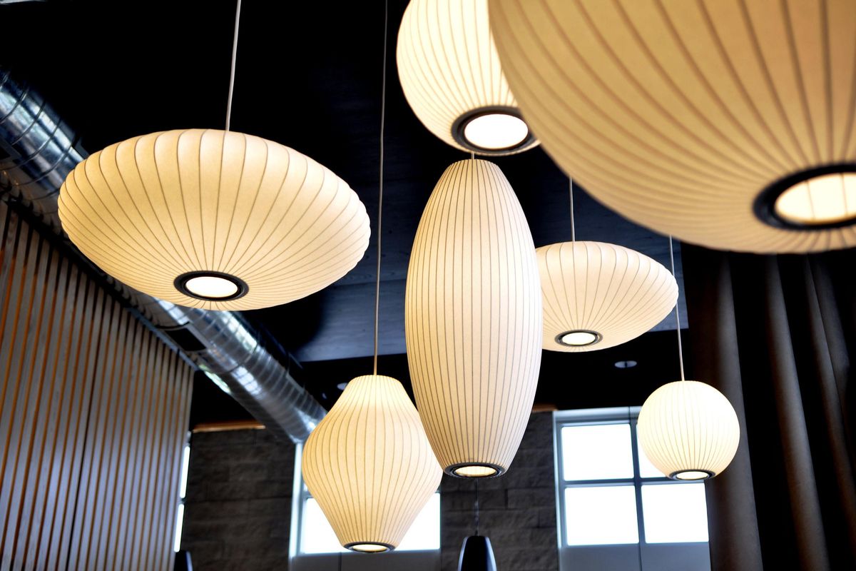 Light fixtures evoking Japanese lanterns hang in the main dining room at Umi in Kendall Yards. (Adriana Janovich / The Spokesman-Review)