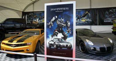 
A Chevrolet Camaro, left, and a Pontiac Solstice take top billing last week in a display promoting the 