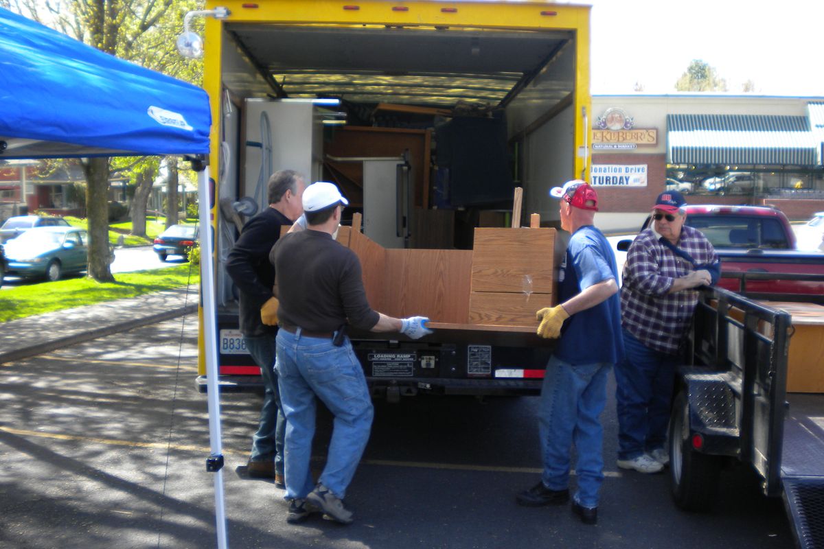 Volunteers load some furniture into a Goodwill truck at a past Donation Drive event. (Courtesy of Goodwill Industries)