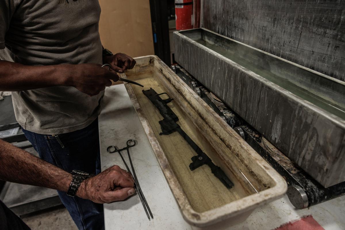 A rifle barrel is processed at Jim Fuller