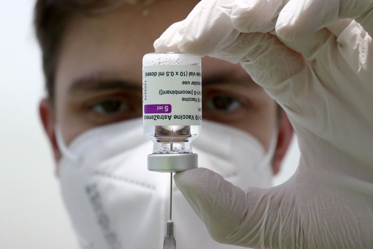 Medical staff prepares a syringe from a vial of the AstraZeneca coronavirus vaccine during preparations at the vaccine center in Ebersberg near Munich, Germany, on Monday.  (Matthias Schrader)