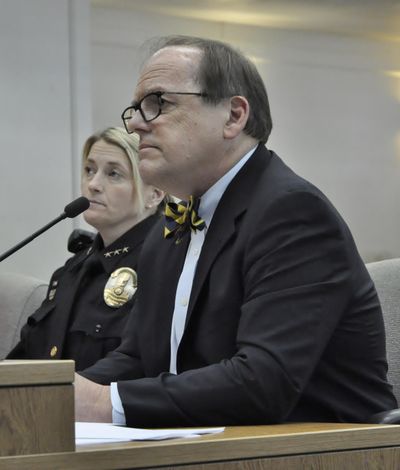 The Evergreen State College President George Bridges, flanked by Campus police Chief Stacy Brown, testifies  at a work session for the Senate Law and Justice Committee on Tuesday in Olympia. (Jim Camden / The Spokesman-Review)