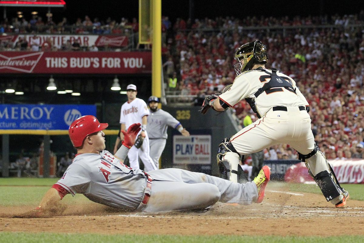 Mike Trout slides home on a hit by Prince Fielder to score his second run of the game as A.L. cruised to All-Star Game victory. (Associated Press)