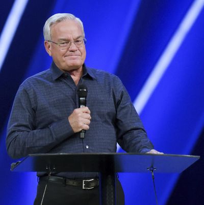 Willow Creek Community Church Senior Pastor Bill Hybels stands before his congregation, Tuesday, April 10, 2018, in South Barrington, Ill., where he announced his early retirement effective immediately, amid a cloud of misconduct allegations involving women in his congregation. (Mark Black / Associated Press)