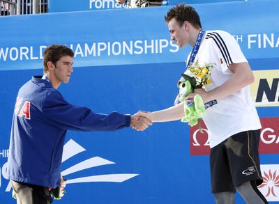 Germany’s Paul Biedermann, right, shakes hands with Michael Phelps of the United States after winning the gold medal of the men’s 200-meter freestyle at the world swimming championships. (Associated Press / The Spokesman-Review)