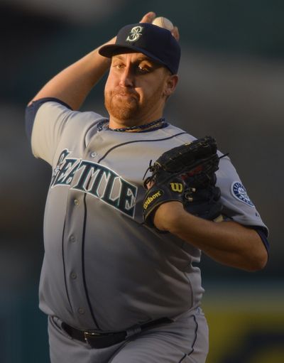 Mariners starter Aaron Harang, who threw a two-hitter against the Astros in his previous start, allowed four runs on 12 hits over five innings. (Associated Press)