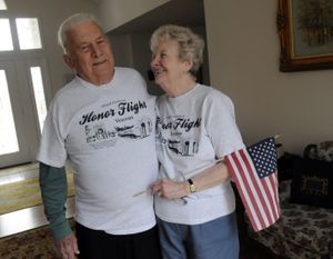 World War II veterans Wilson and Connie Conaway celebrate their return from a recent Inland Northwest Honor Flight. Their 64th wedding anniversary is near. (J. Bart Rayniak)