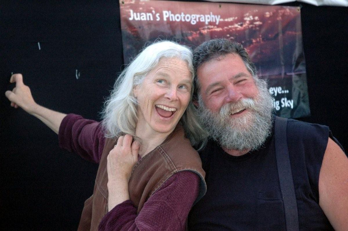 Owners Juan and Randi de Santa Anna of Juans Photography eagerly pose just before the start of another art show. Sales of photographs are an important source of income for this Montana-based business. (MIKE BRODWATER Photos / The Spokesman-Review)