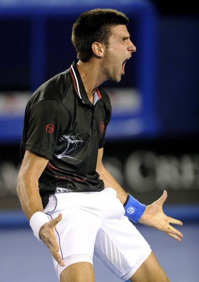 Novak Djokovic celebrates after beating Rafael Nadal in a match that lasted 5 hours, 53 minutes. (Associated Press)