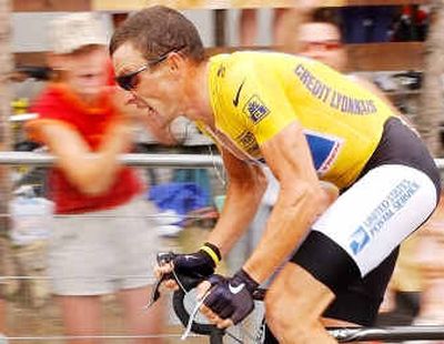 
Ovrall race leader Lance Armstrong, of Austin, Texas, strains during the 16th stage of the Tour de France cycling race, an individual time trial between up the L'Alpe d'Huez.
 (Associated Press / The Spokesman-Review)