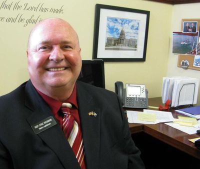 State Rep. Eric Redman, R-Post Falls, at his desk in the Idaho Capitol. (Betsy Russell/Eye on Boise photo)