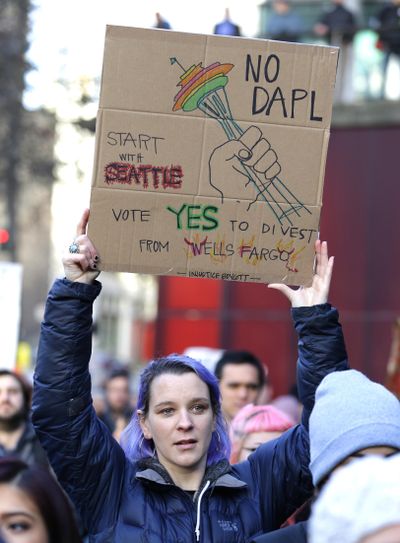 Lela Wulsin of Seattle  protests against the Dakota Access Pipeline Wednesday at City Hall in Seattle. (Ted S. Warren / Associated Press)