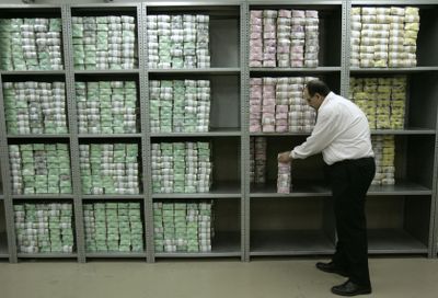 An employee stacks packets of currency in a safe as he works in the Central Lebanese Bank in Beirut, Lebanon,  in November 2008.  The Lebanese banking sector grew in 2008.  (Associated Press / The Spokesman-Review)