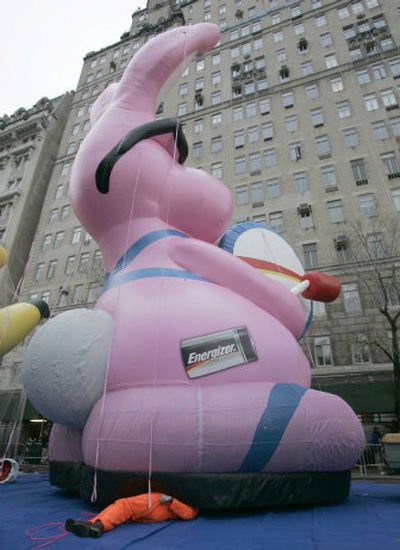 
Peter Kagey works beneath the Energizer Bunny balloon Wednesday in preparation for today's parade  in New York. 
 (Associated Press / The Spokesman-Review)