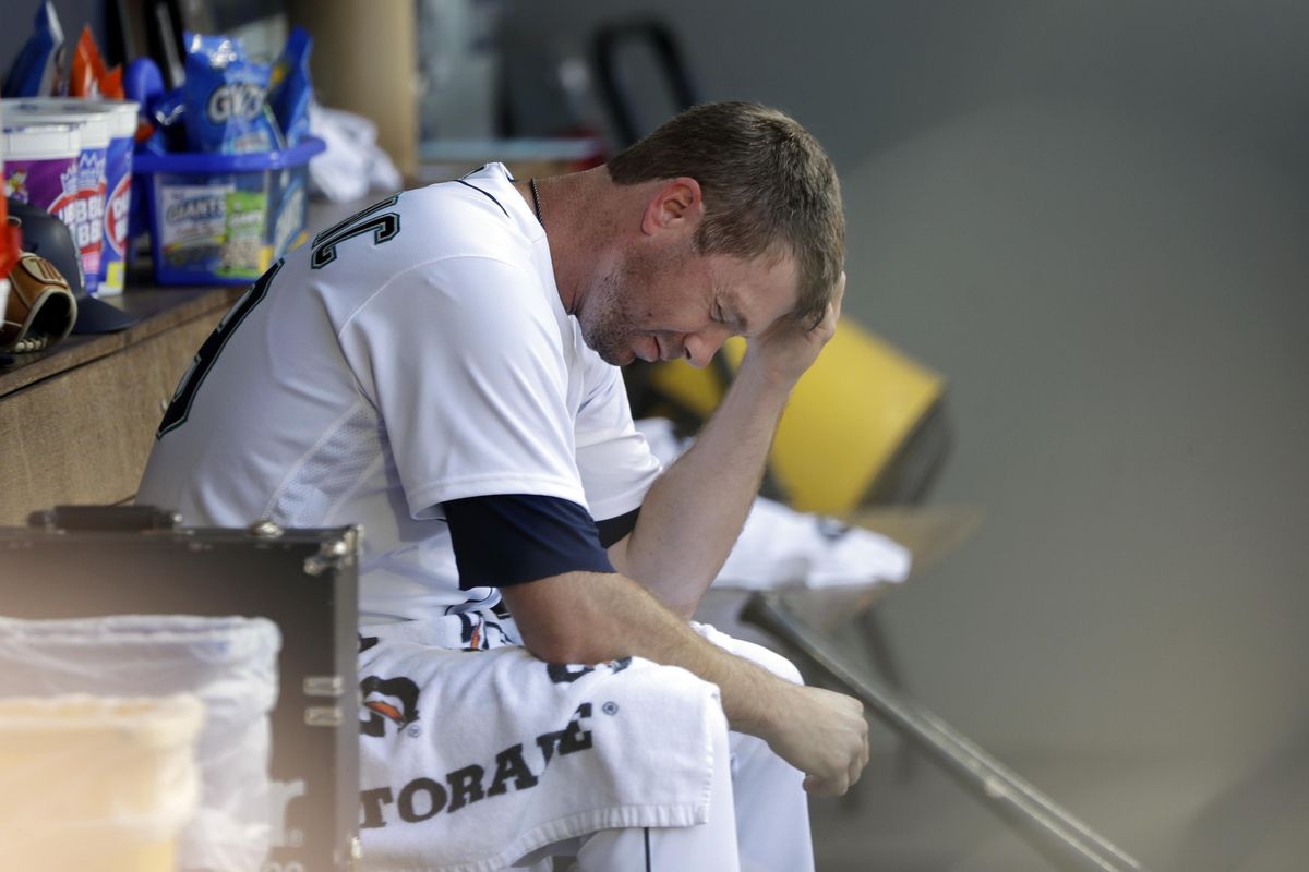 Seattle Mariners starting pitcher Wade LeBlanc sits in the dugout after being relieved in the fifth inning against the Houston Astros on Wednesday in Seattle. (Elaine Thompson / Associated Press)