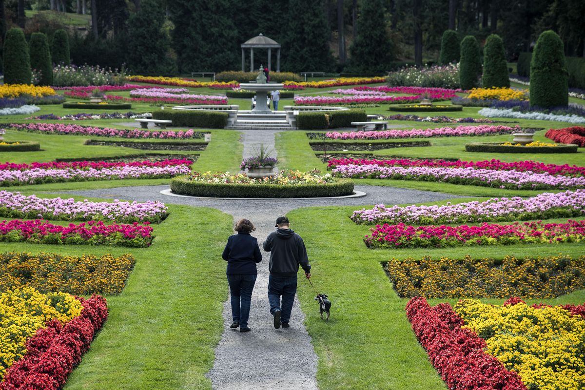 FILE - Visitors to the Duncan Gardens in Manito Park stroll past some the 35,000 plants in October 2016. (Dan Pelle / The Spokesman-Review)